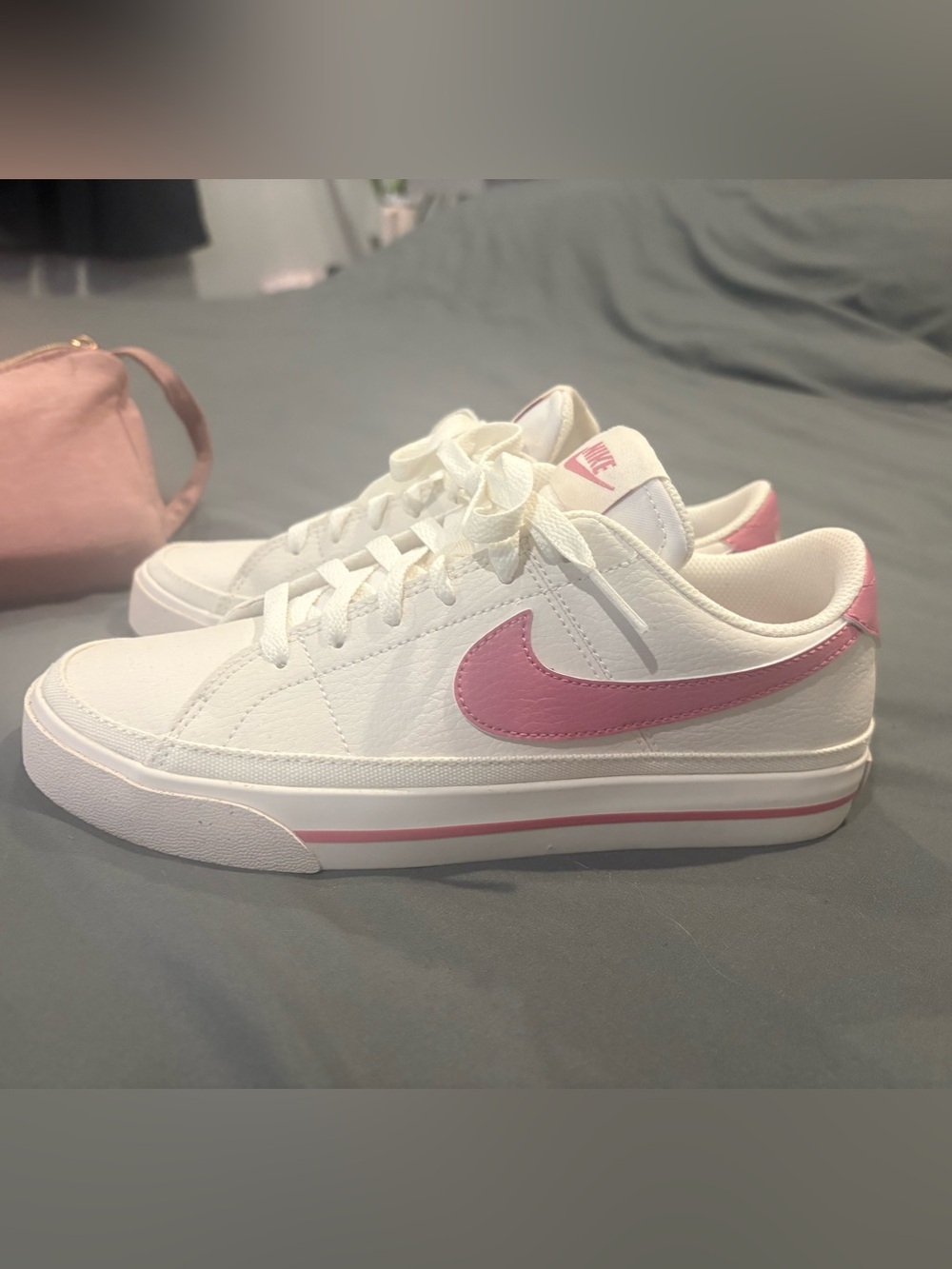 Nike Women's White Low-Top Sneakers with Pink Swoosh
